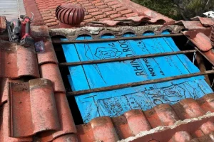 Clay tile roof opened up for leak repair