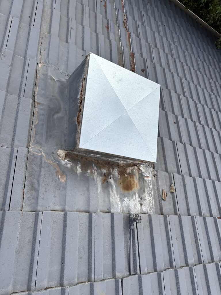 Skylight on a tiled roof prior to repair